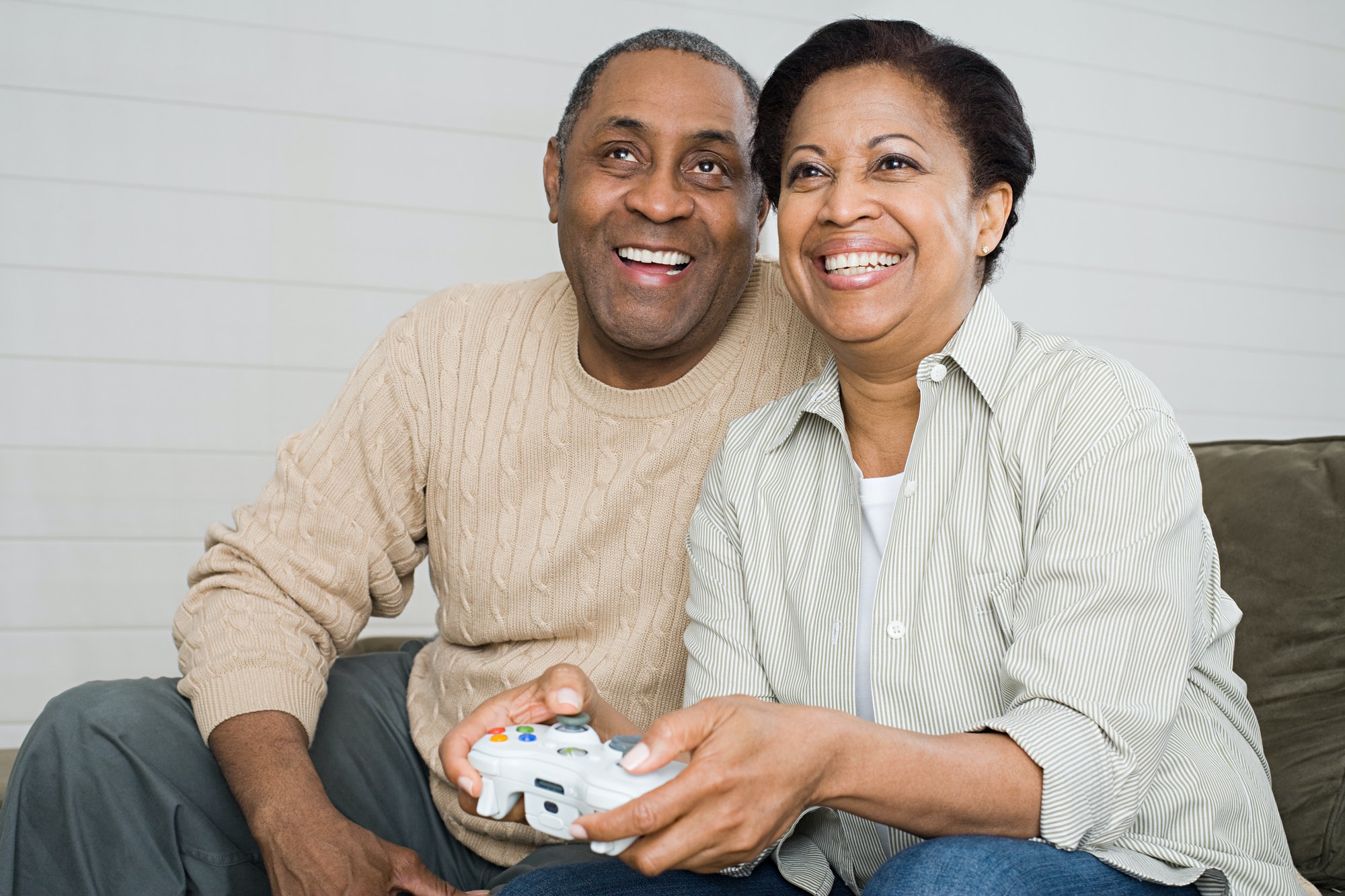 Mature couple playing video game